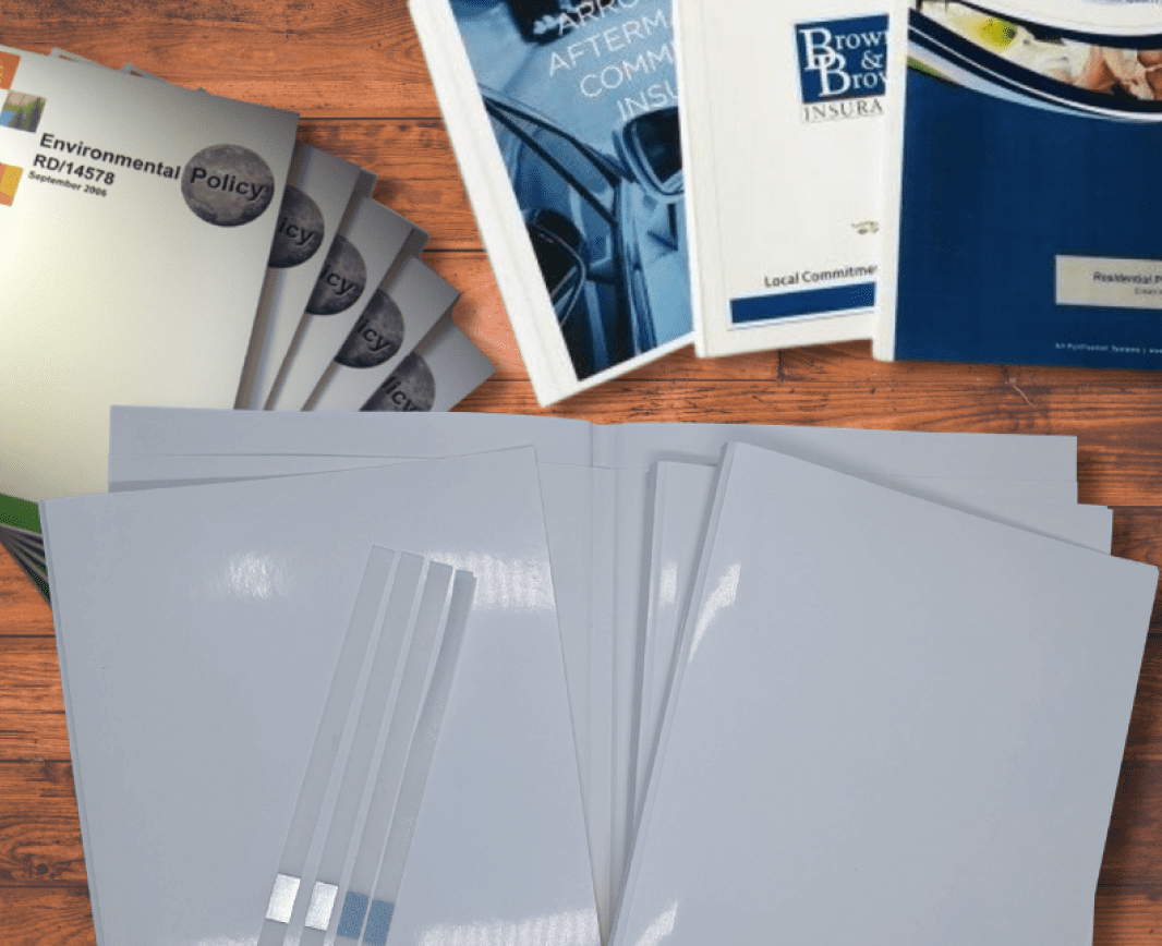 Assorted business and policy documents on table.